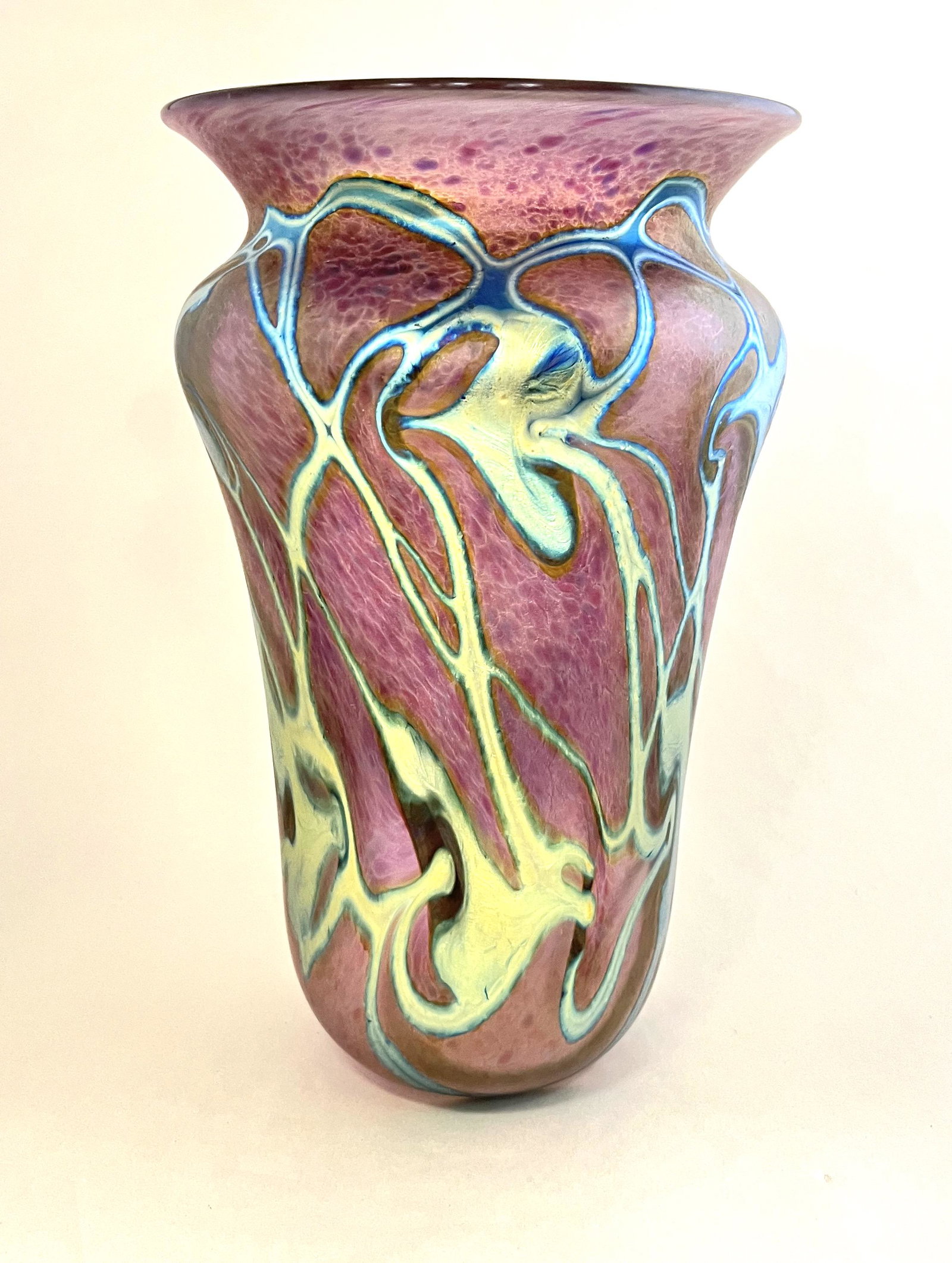 John Lotton crimson art glass vase: John Lotton mottled red glass vase decorated with iridescent blue hearts and vines, signed John Lotton 1998, 10 1/4" ht. CONDITION: no chips, cracks, repairs or material defects found. Jaremos attempt