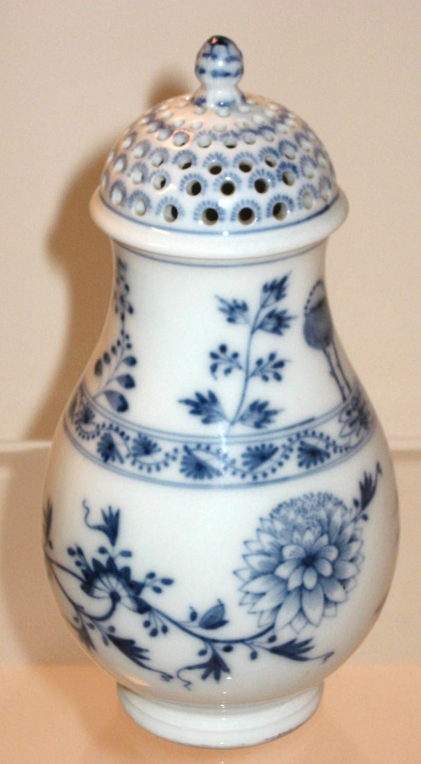 German KPM sugar shaker,: in the blue onion pattern, marked with a blue scepter mark, 7 1/4" ht. CONDITION: good with no chips cracks or repairs.