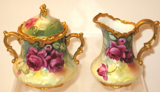 Pickard porcelain cream and sugar,: decorated with roses and gold highlights, marked, JP France Pickard, 4 1/2" ht. CONDITION: good with no issues.