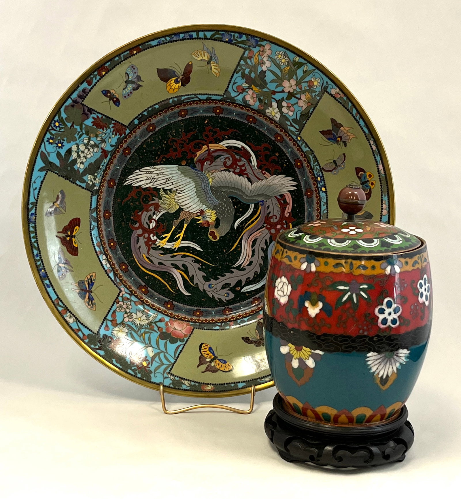 2 Japanese cloisonne items: 2 Japanese cloisonne items, including a jar with cover and a charger plate. Circa late 19th early 20th century. Plate 12" diameter, jar 7" ht. CONDITION: no chips, cracks, repairs or material defects 