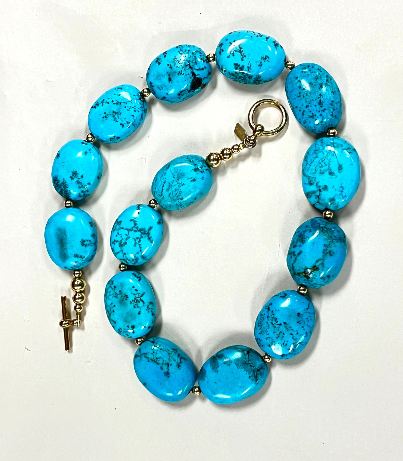Beeman Turquoise bead necklace: Beeman Turquoise bead necklace having 14 beads, marked Beeman, 20" long. CONDITION: no chips, cracks, repairs or material defects found. Jaremos attempts to call any material flaw that affects the pri