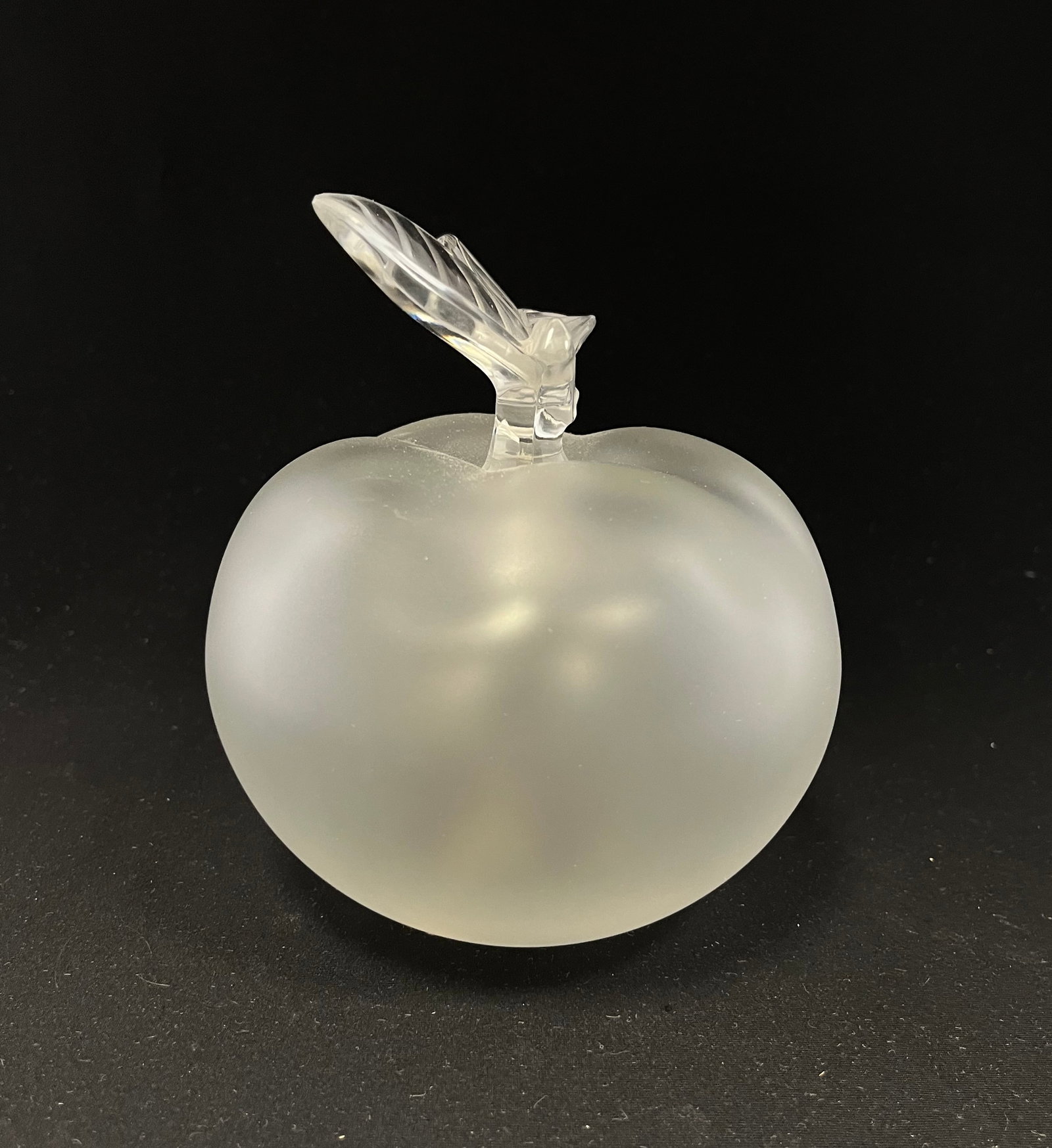 Lalique frosted apple perfume: Lalique figural frosted perfume in the form of an apple with a translucent branch stopper, signed, 5 3/4' ht. CONDITION: no chips, cracks, repairs or material defects found. Jaremos attempts to call a