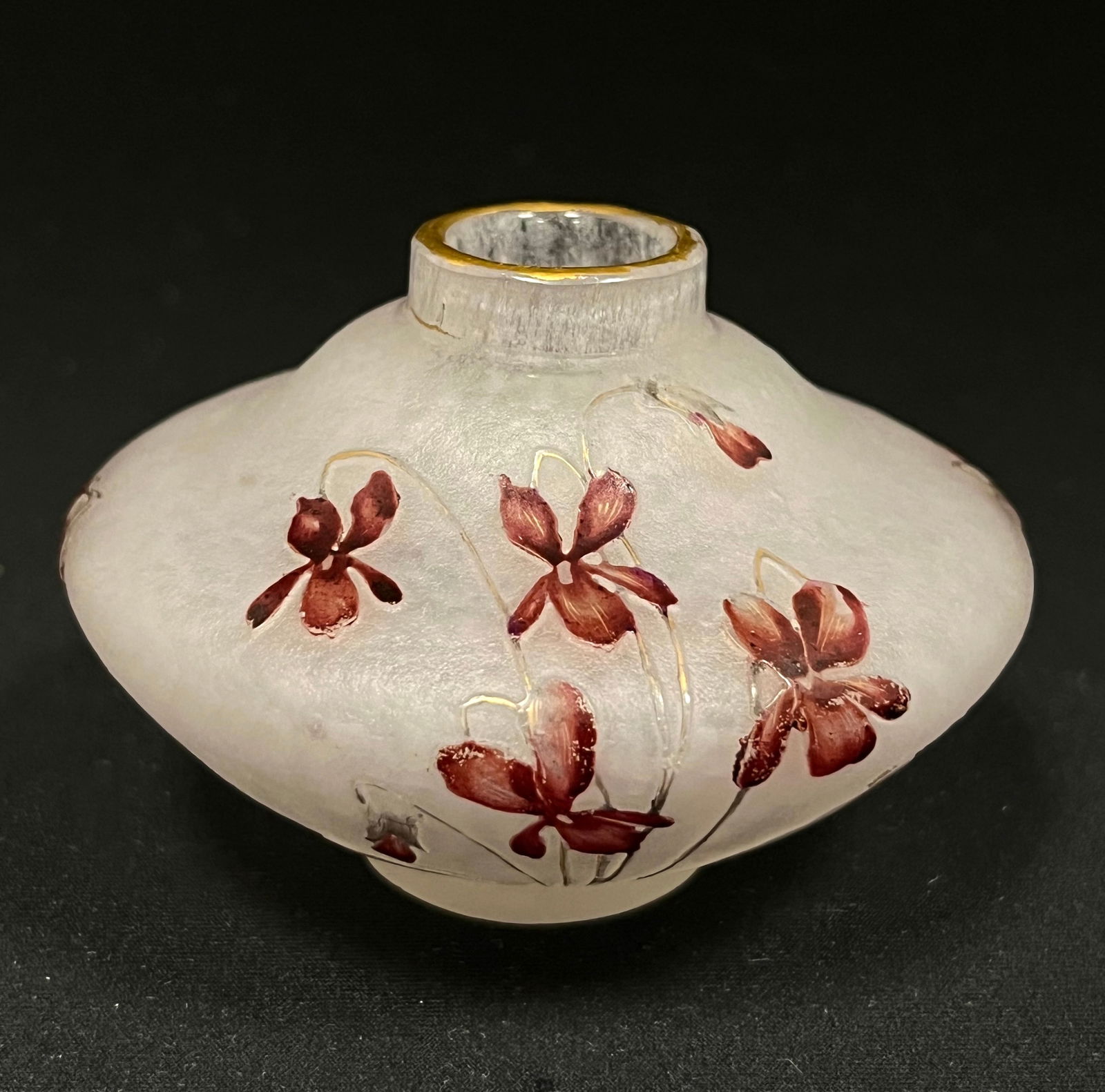 Daum Nancy French cameo glass vase: Daum Nancy squatty form frosted pink cameo glass vase decorated with red stemmed flowers, signed in gold Daum Nancy, 3" wide. CONDITION: no chips, cracks, repairs or material defects found. Jaremos at