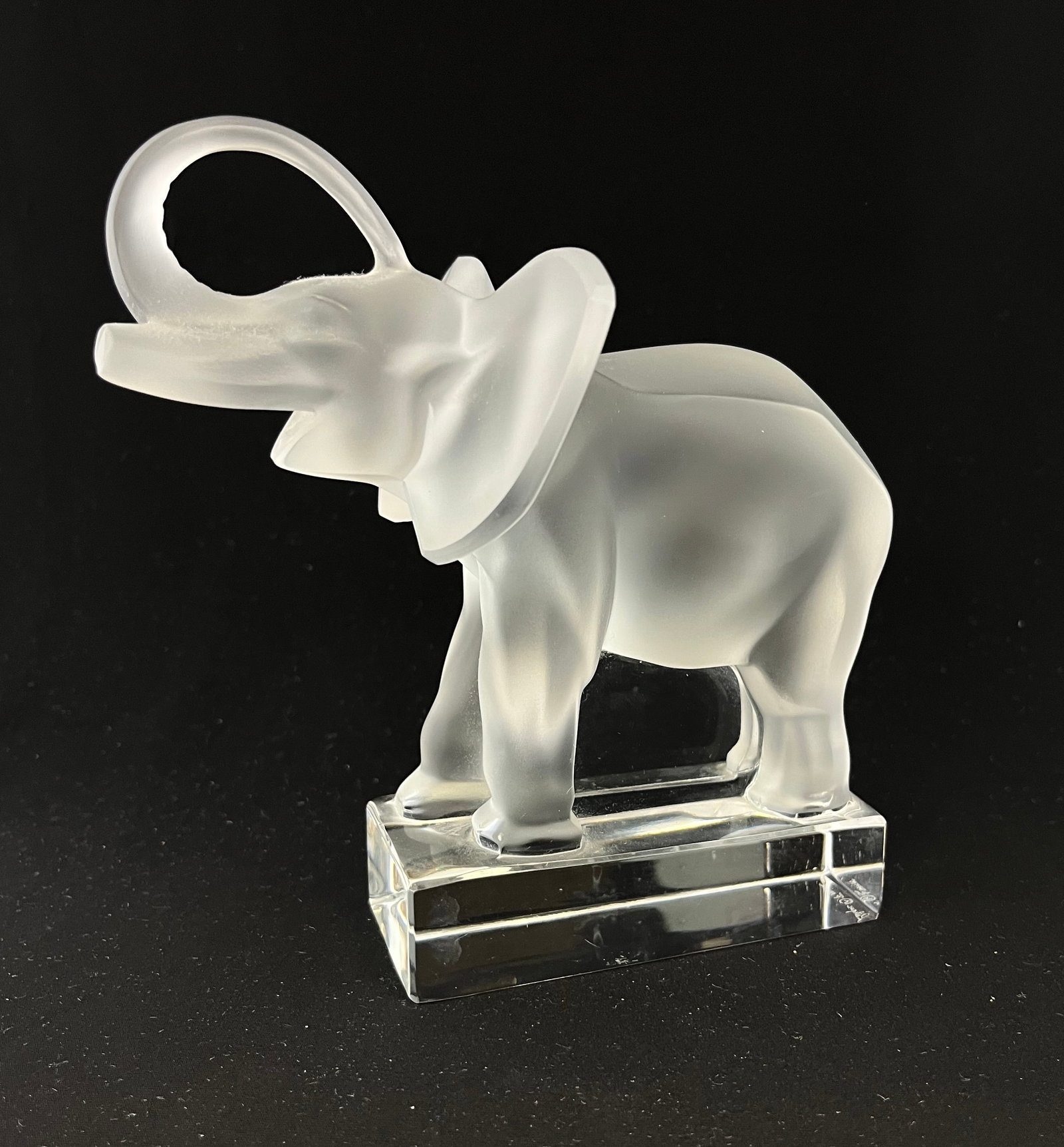 Lalique frosted glass elephant: Lalique frosted glass elephant, signed Lalique, 6" ht. CONDITION: no chips, cracks, repairs or material defects found. Jaremos attempts to call any material flaw that affects the price, but minor scra