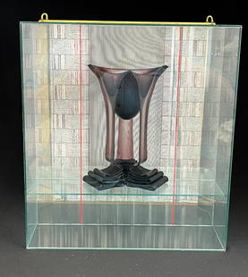 Sydney Cash art glass vase and box: Sydney Cash purple melting glass flower form fitted in a framed box with a 3D Visual effect, back signed Cash 89 "Last Laugh" 12" ht. CONDITION: no chips, cracks, repairs or material defects found. Ja