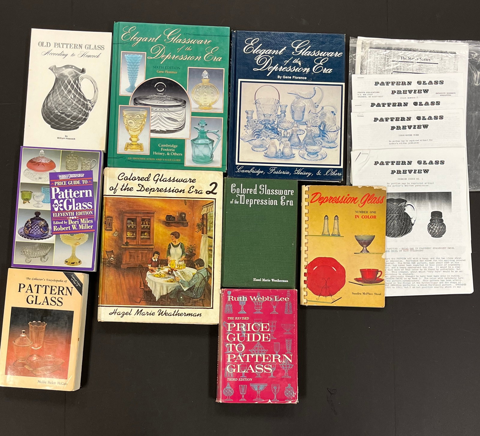 16 books and newsletters on pattern glass: 16 books and newsletters on pattern glass including 2 Colored Glassware of the Depression Era by Weatherman, Depression Glass in Color by Stout, Old pattern Glass by Heacock, Elegant Glassware of the 