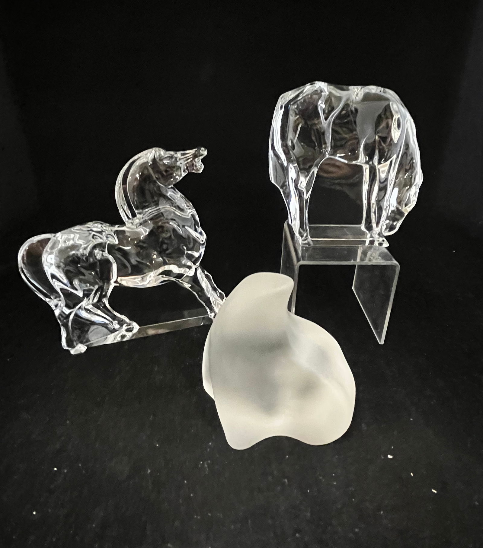 Group of Hoya and other glass animals: Two Hoya clear crystal glass horses together with a frosted glass seal, one horse with a gift box, tallest 6" ht. CONDITION: Good with no defects found
