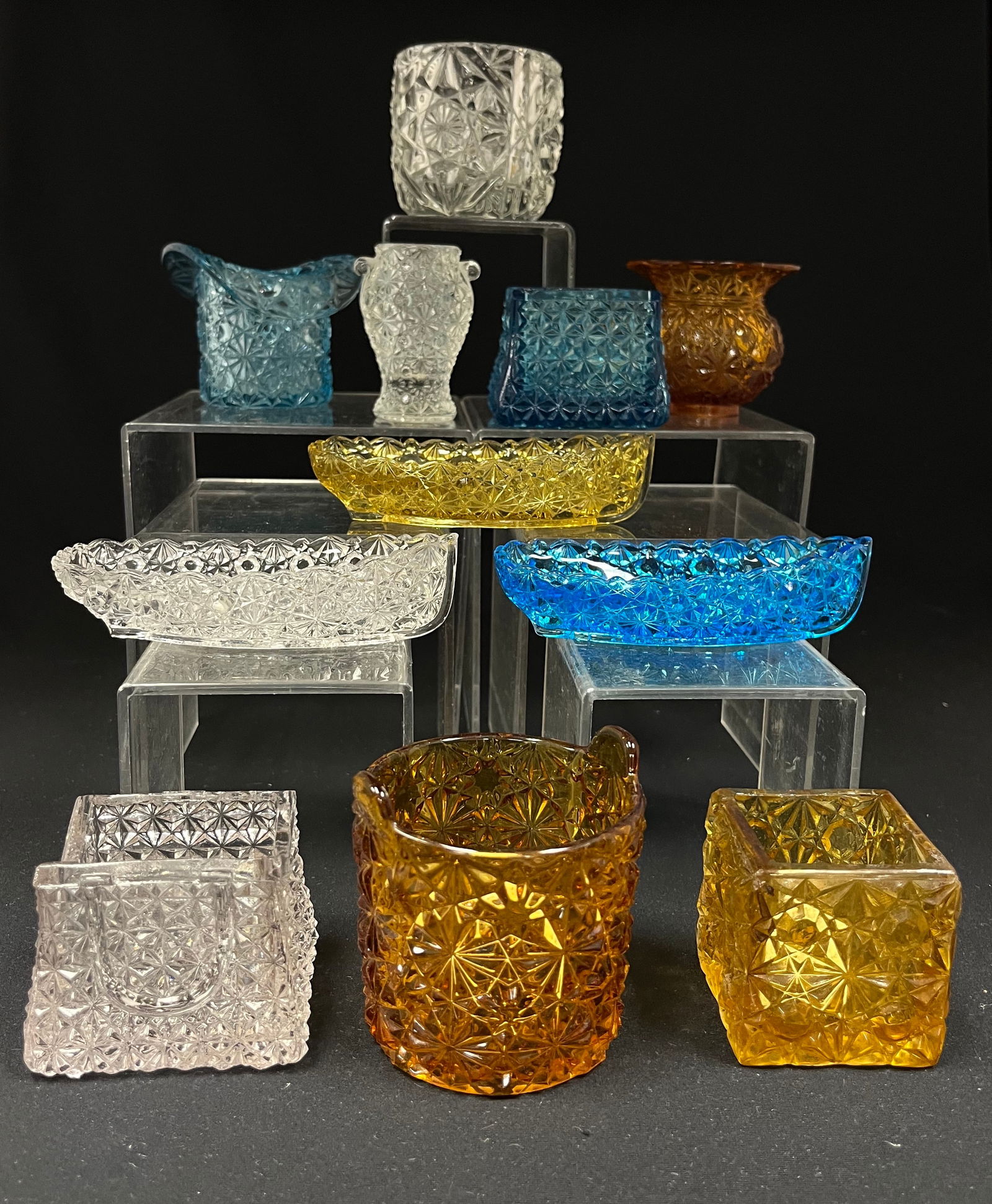 Group of 11 Daisy and Button toohpicks: Group of 11 Daisy and Button glass toothpicks, various shapes and colors, tallest 2 1/2' ht. CONDITION: good with minor wear. Jaremos attempts to call any material flaw that affects the price, but min