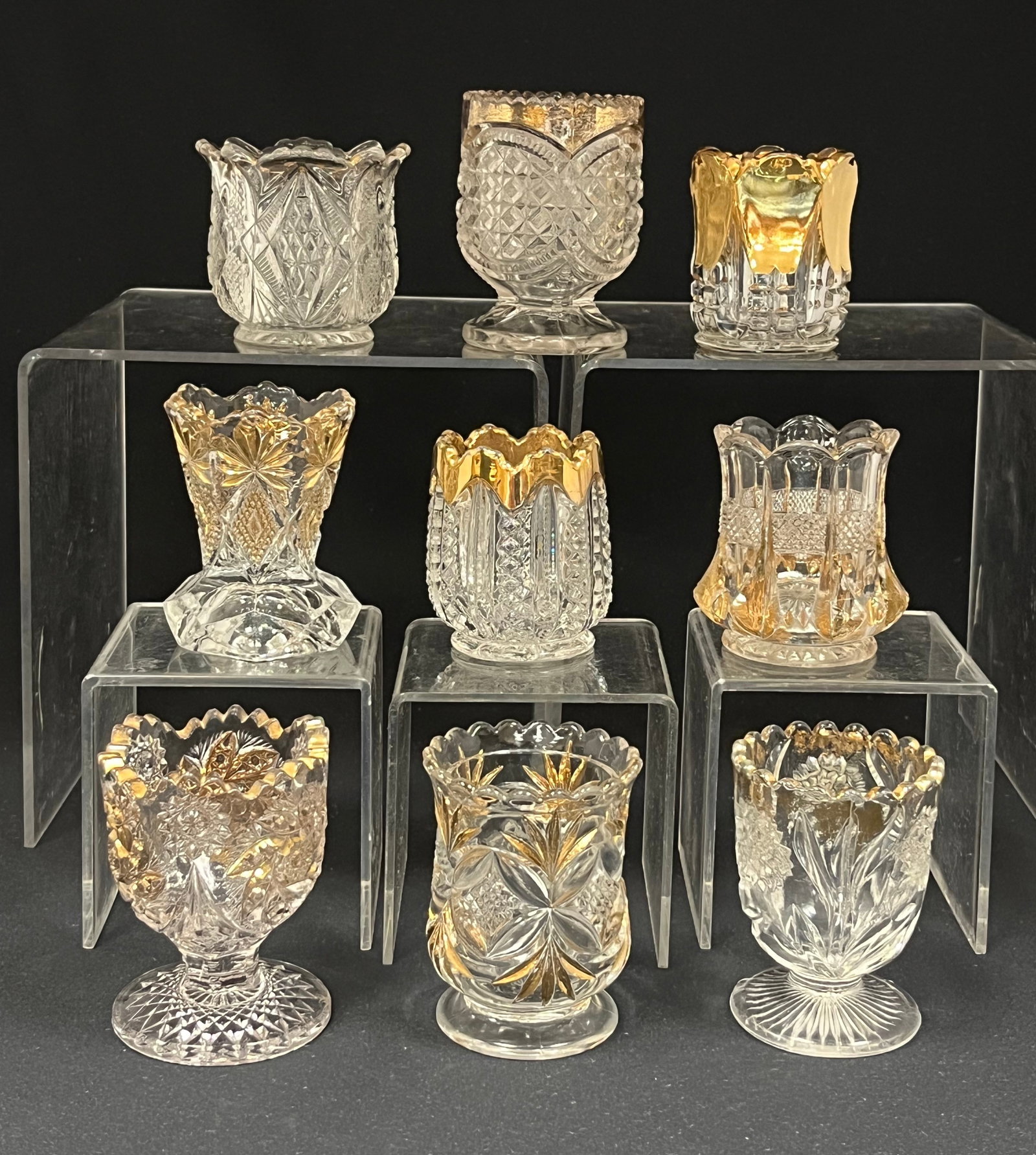 9 gold stained glass toothpicks: 9 EAPG toothpicks with gold highlights including Shoshone, Paddlewheel, Carnation, Banded Portland, Pillows and Sunburst, Greentown Austrain an more. Tallest 3" ht. CONDITION: good with minor wear. Ja