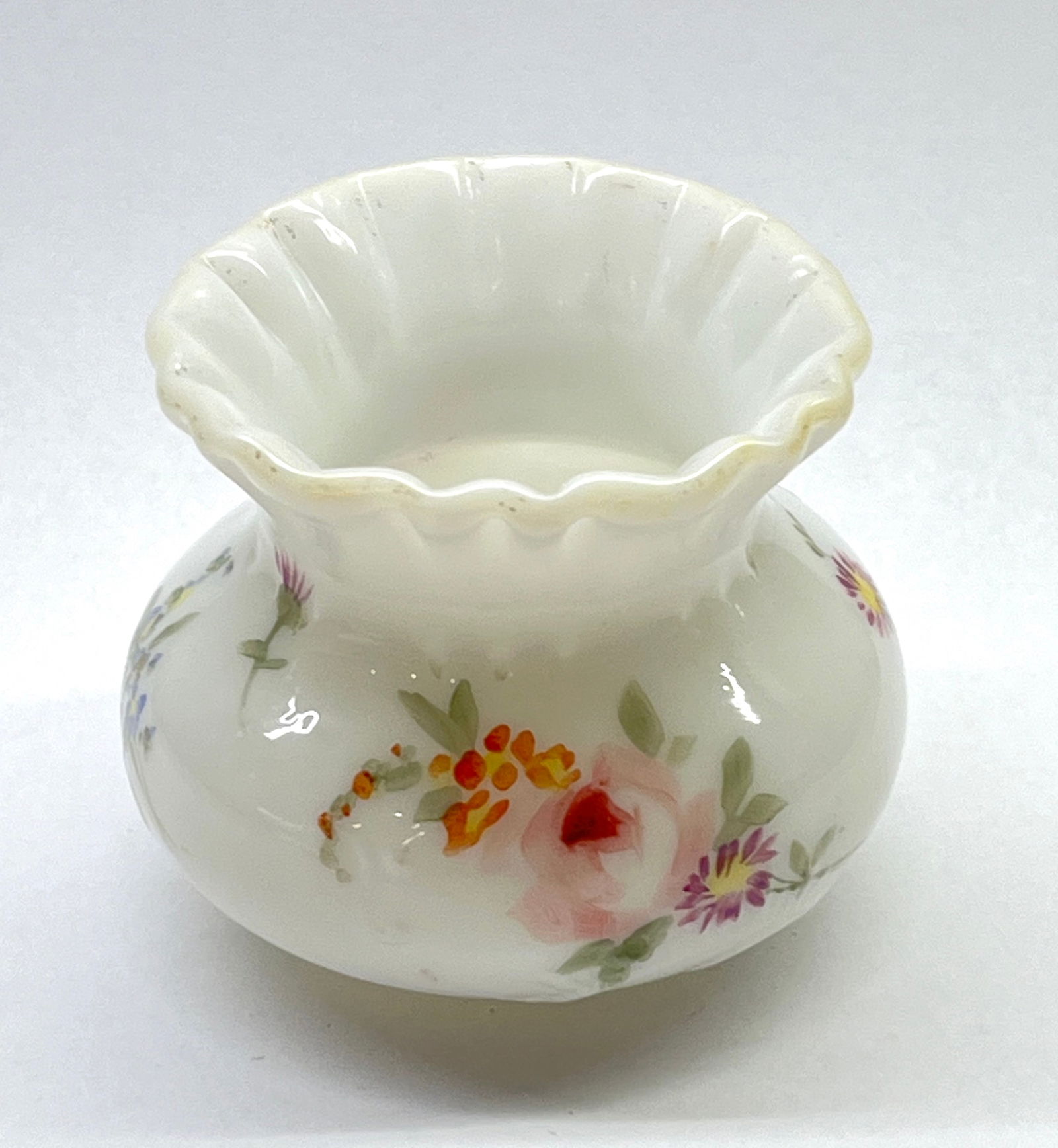 Rare Mt. Washington Colonial ware: Rare Mt. Washington Colonial ware toothpick holder in opal glass decorated with pink roses, 2" ht. CONDITION: no chips, cracks, repairs or material defects found. Jaremos attempts to call any material