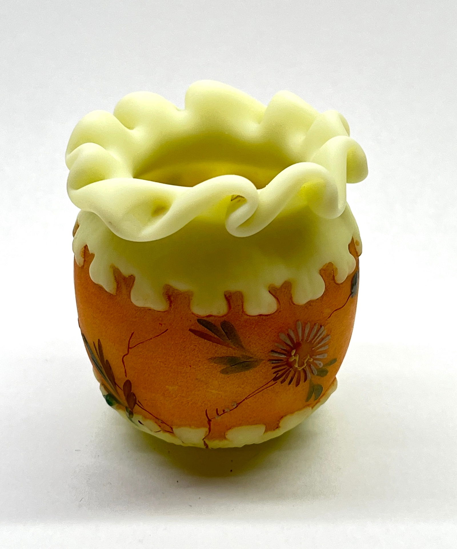 MT. Washington greek key holder: Mt Washington greek key opal toothpick holder with a orange interior decorated with colorful flowers, 2 1/2" ht. CONDITION: no chips, cracks, repairs or material defects found. Jaremos attempts to cal