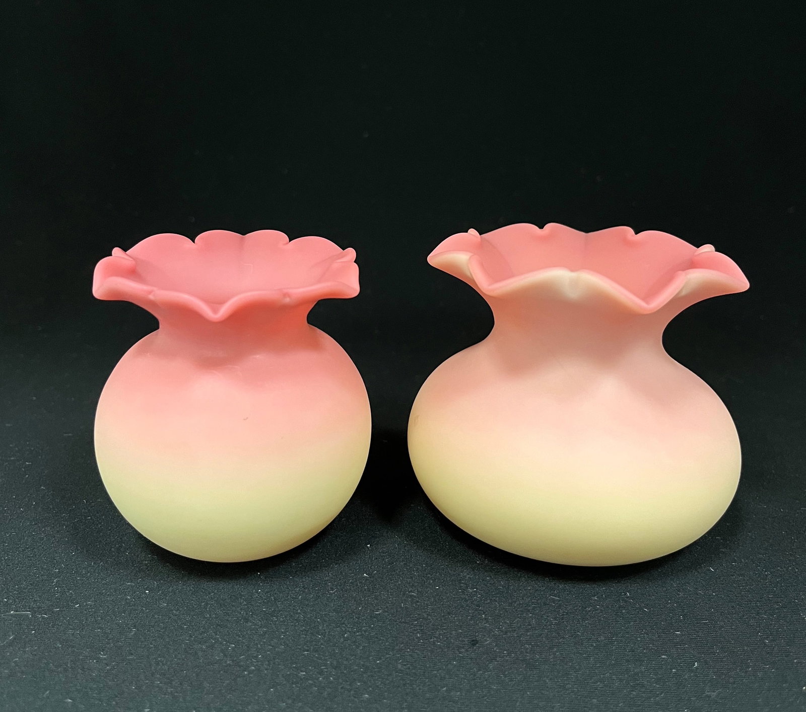 Two Webb Burmese rose bowls: Two satin finished Burmese rose bowls with crimped star top rims, one signed with an acid stamp, tallest 2 3/4" ht. CONDITION: no chips, cracks, repairs or material defects found. Jaremos attempts to 