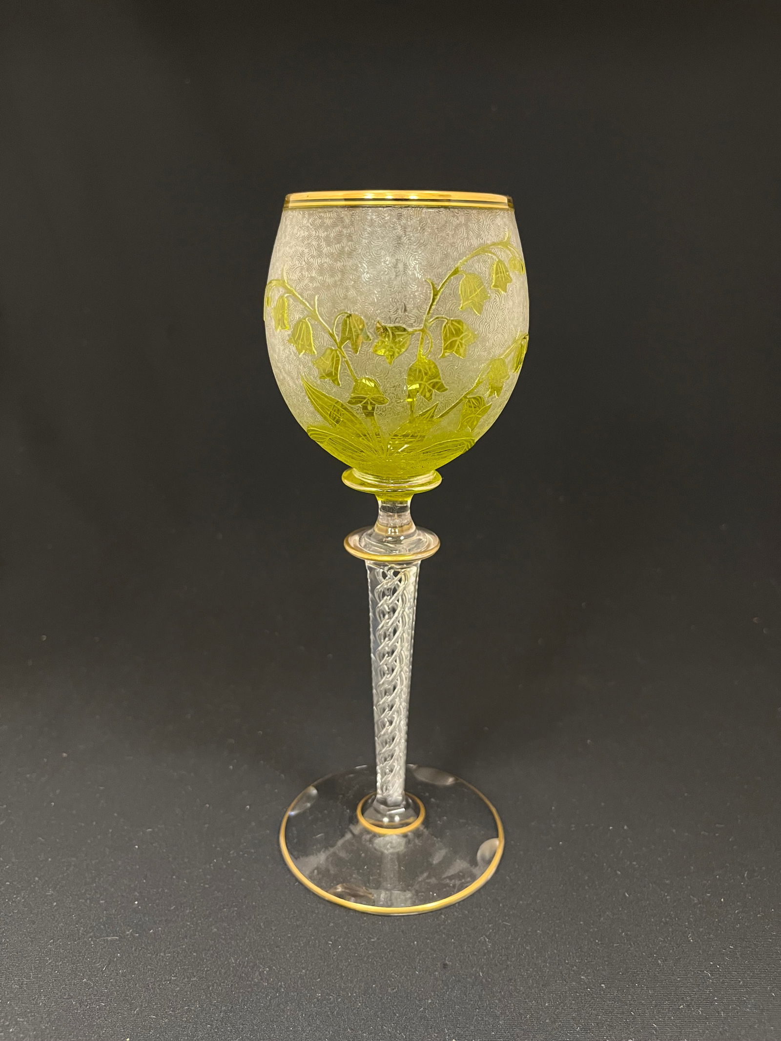 Val St. Lambert cameo glass goblet: Val St. Lambert needle etched goblet decorated with green cameo bleeding heart stemmed flowers, air twost stem, 8" ht. CONDITION: carved half moons on the base. Jaremos attempts to call any material f