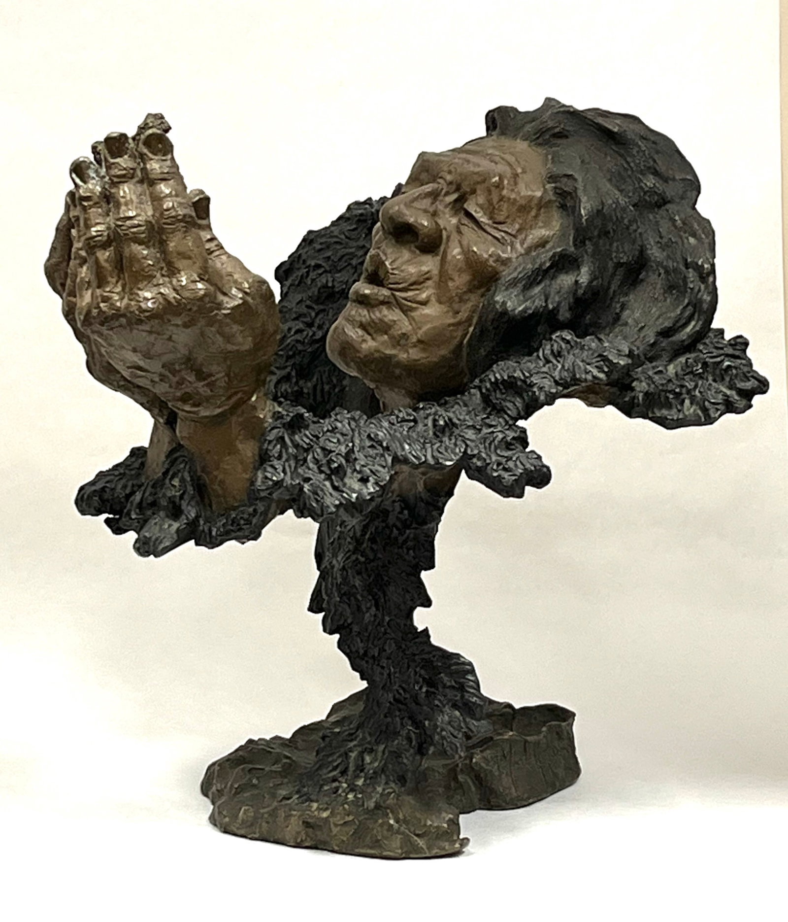 Bronze Western Indian sculpture: Bronze Western Indian head, Fire Starter, signed Mark Hopkins and numbered 151 of 450. Ht. 12". CONDITION: no repairs or material defects found. Jaremos attempts to call any material flaw that affects