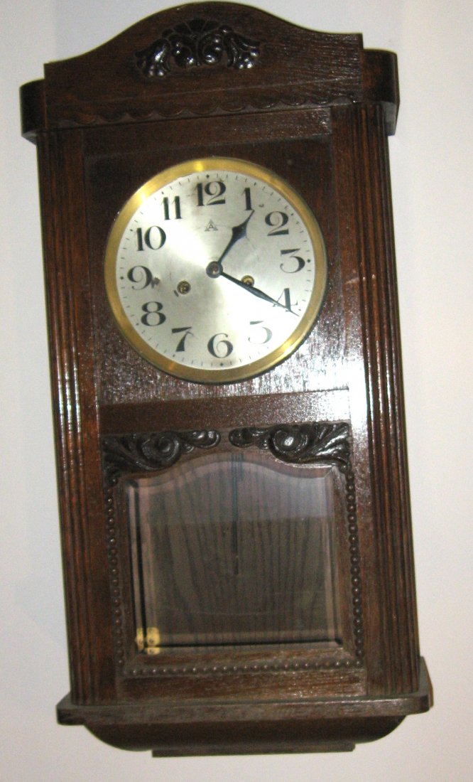 German Box clock,: circa 1900 missions style spring driven with rope chimes, 26" ht.