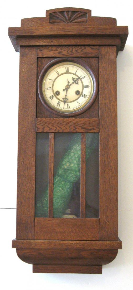 Junghans German oak box clock,: circa 1900 missions style 8 day time and strike with an R A pendulum, 30" ht.