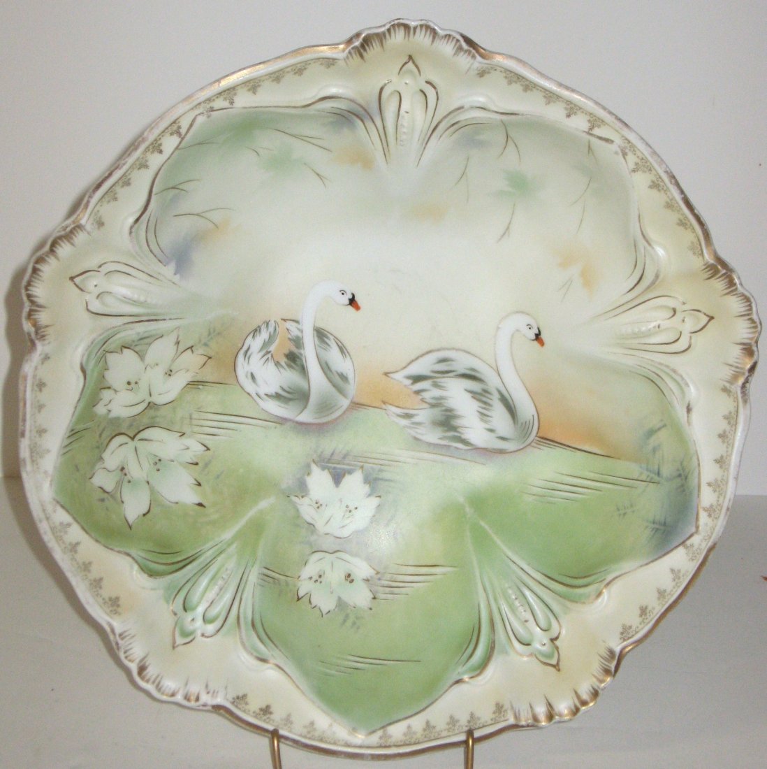 R. S. Prussian serving bowl,: decorated with swimming swans, marked with the red trademark, 10 1/2" wide.
