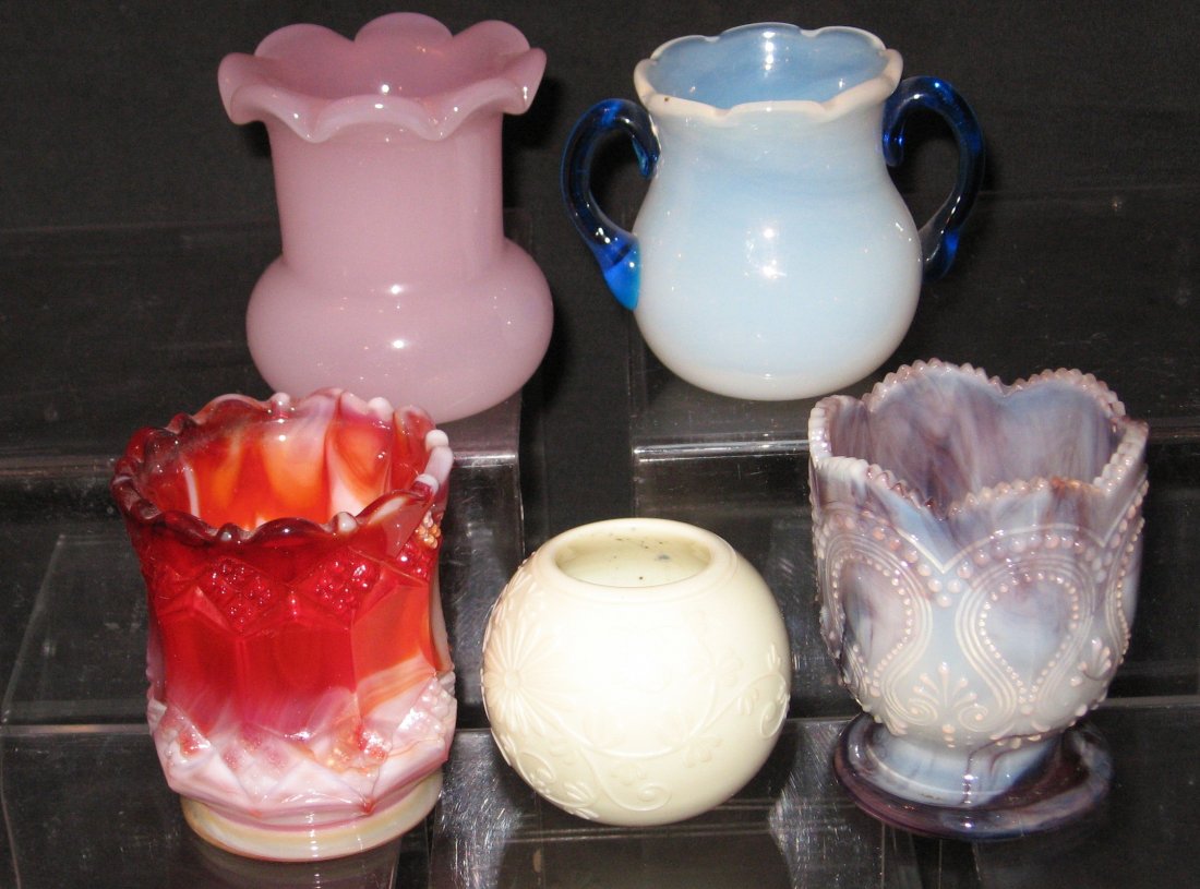 Five decorative toothpick holders,: including a Rosaline, a purple slag scroll with Acanthus, a red slag, a Fry type opalescent with blue handles, and more, 2 1/2" ht.