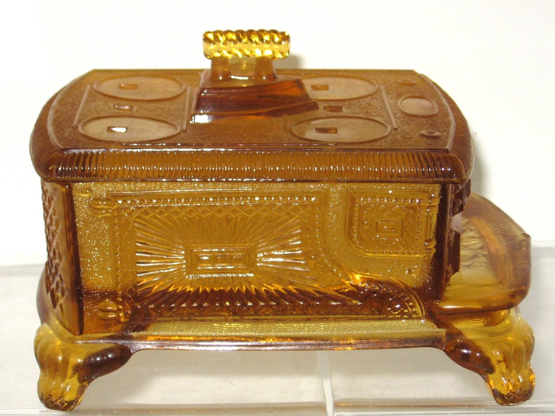 EAPG Stove covered butter dish,: produced by King and Sons, circa 1880, 7" long. PROVENANCE: Larry Loxterman collection