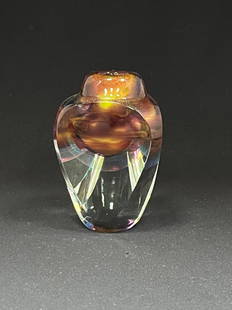 Jon Kuhn Art Glass vase: Jon Kuhn three sided faceted glass vase in translucent glass with a red and amber core and rainbow aventurine, 4" ht. CONDITION: no chips, cracks, repairs or material defects found. Jaremos attempts t