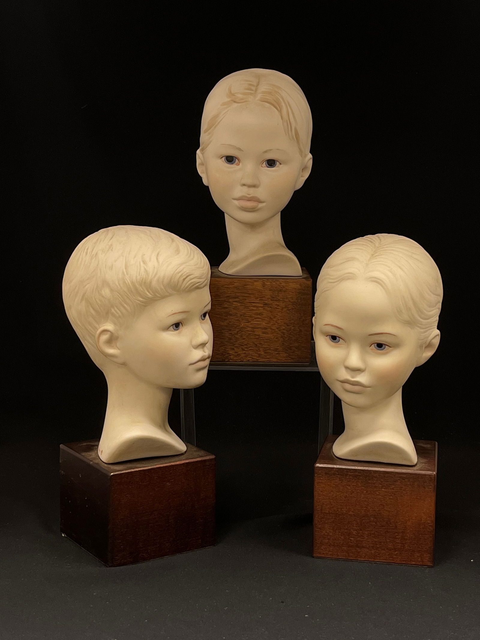 Three Cybis Bust of Children: Three Cybis Busts of children including two girls and a boy; tallest 9" ht.; signed. CONDITION: no chips, cracks, repairs or material defects found, Jaremos attempts to call any material flaw that aff