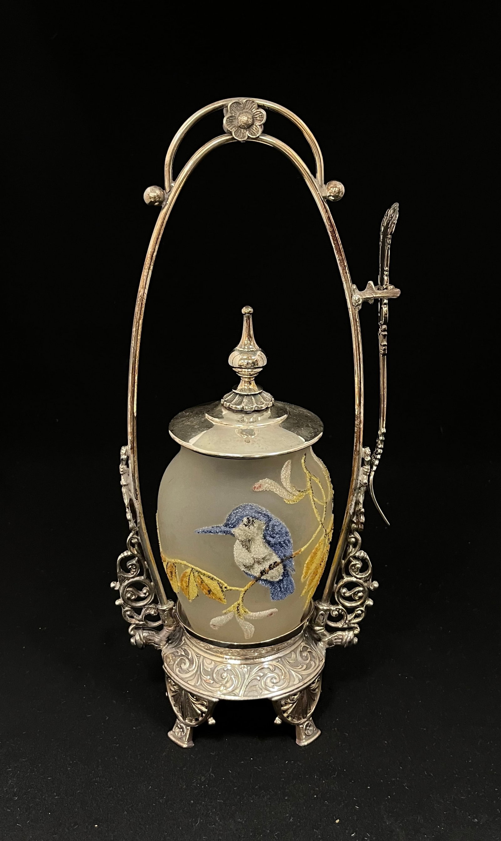 Coraline pickle castor: Coraline pickle castor in frosted glass decorated with a bird on branch set in a Rockford holder with fork, 12" ht. CONDITION: no chips, cracks, repairs or material defects found, Jaremos attempts to 