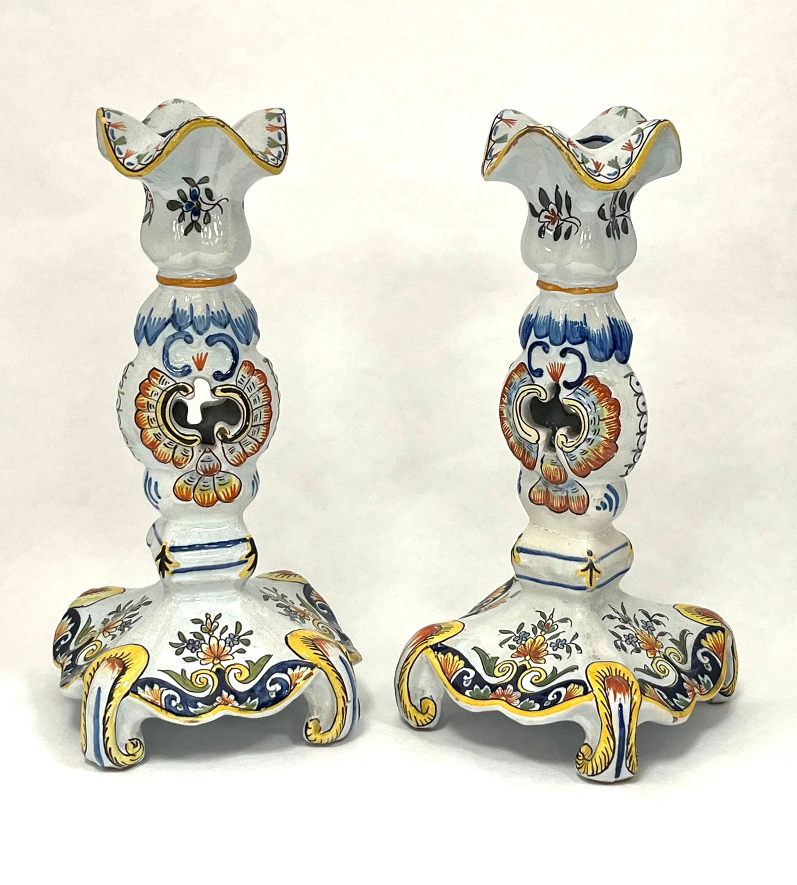 Pair of Desvres candlestick: Pair of Desvres French Faience candlesticks, 10" ht. CONDITION: one with repair