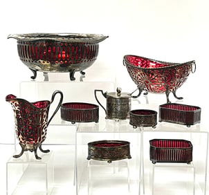 9 piece grouping of cranberry Pairpoint