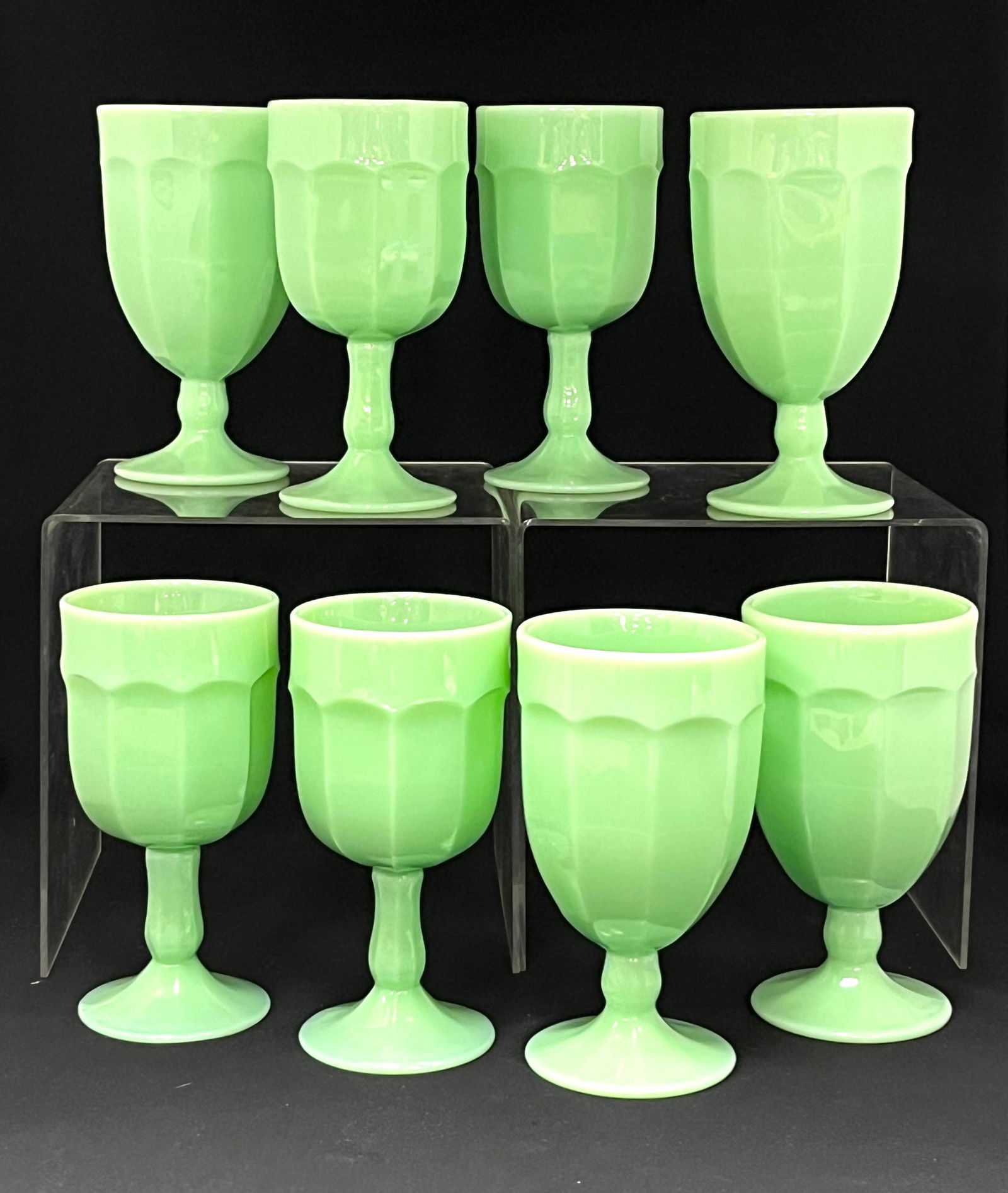 8 Jadite Goblets: 8 Jadite goblets, 4 iced teas, 4 waters, 7" tall. CONDITION: no chips, cracks, repairs or material defects found, Jaremos attempts to call any material flaw that affects the price, but minor scratches