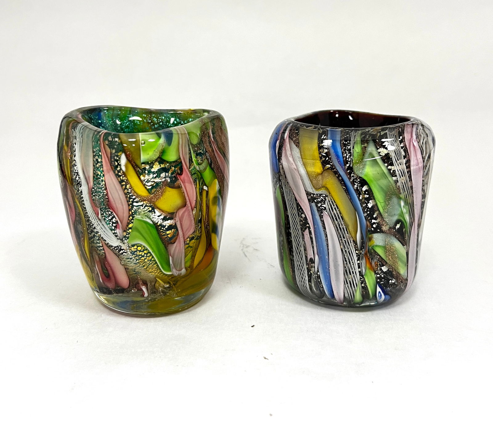 Two Murano toothpick holders: Two Murano latticino toothpick holders with colorful ribbons and aventurine, 2 3/4" ht. CONDITION: no chips, cracks, repairs or material defects found, Jaremos attempts to call any material flaw that