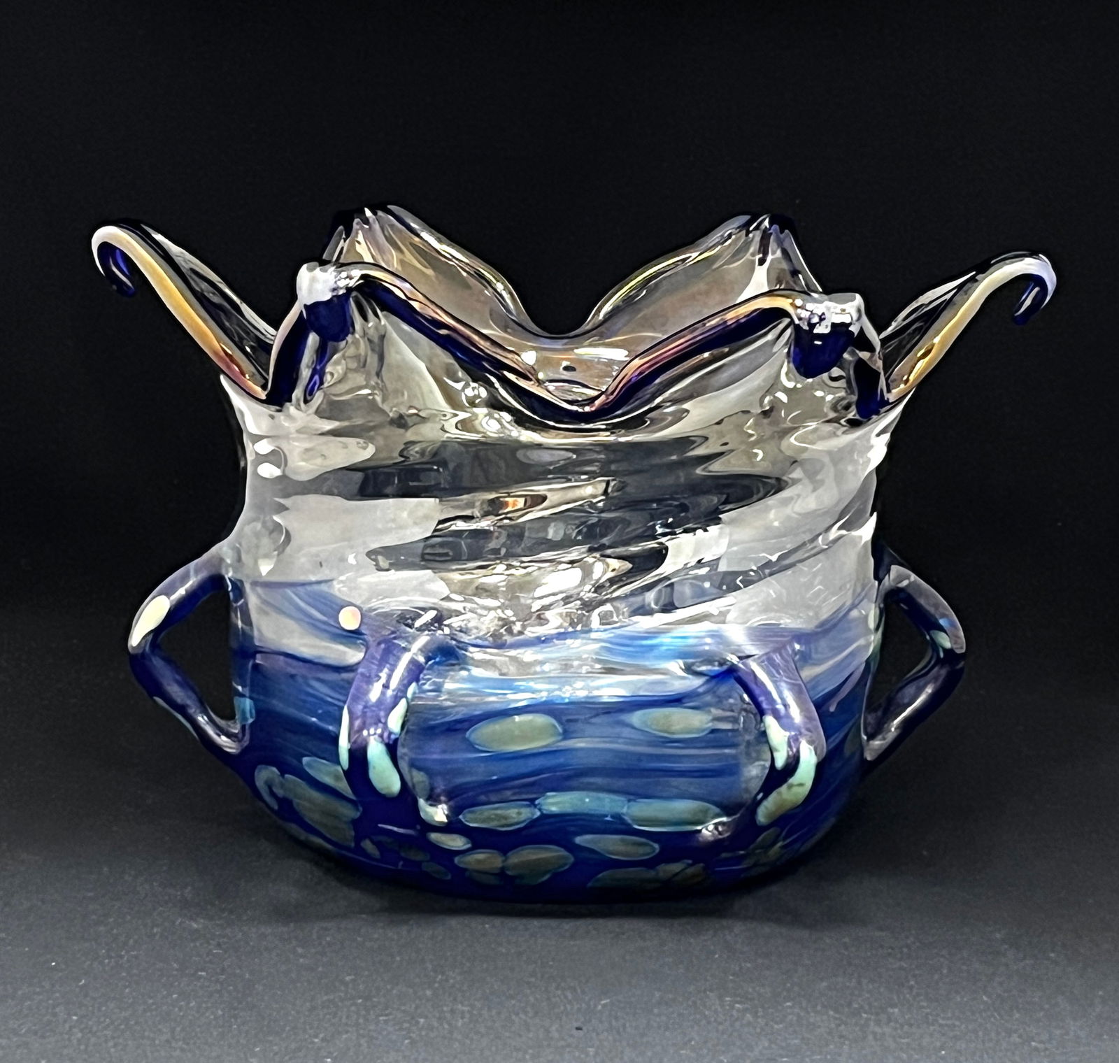 Loetz New Cytisus handled bowl: Loetz New Cytisus art glass bowl in translucent glass with a crown top tilled in blue decorated with a blue and gold oil spot pattern and adorned with six side handles, 11" wide by 8" ht. CONDITION: n