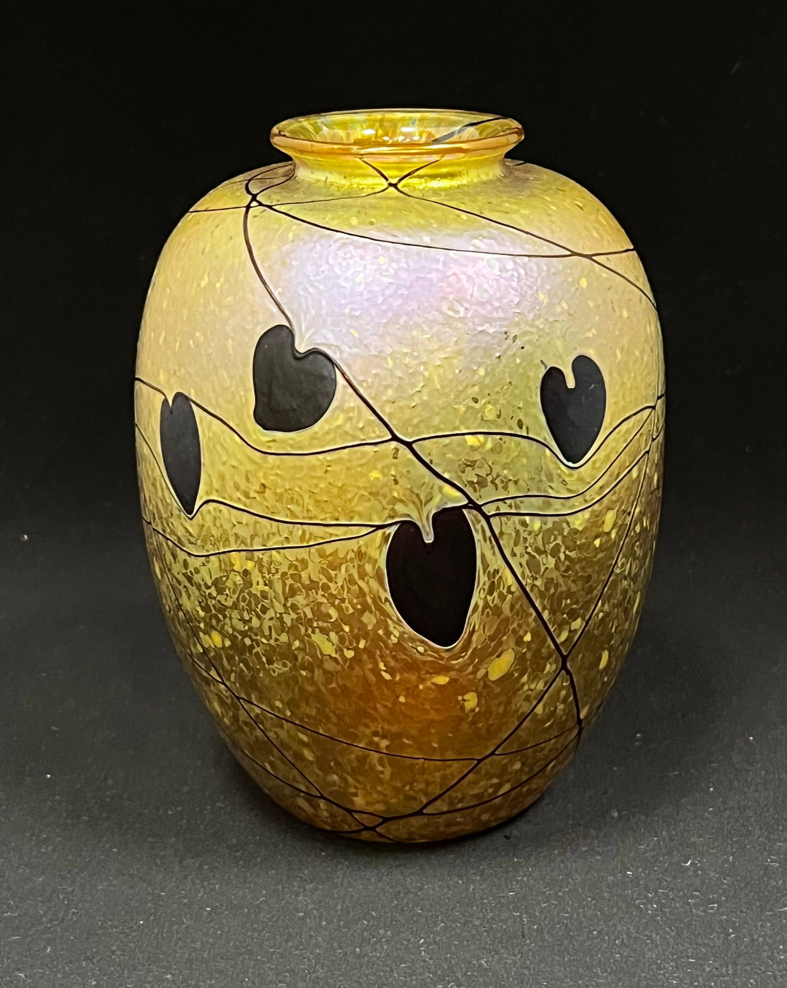Donald Carlson heart and vine vase: Donald Carlson iridescent gold ovoid glass vase decorated with dark crimson heart and vines, signed Carlson 76, 6 1/2" ht. CONDITION: no chips, cracks, repairs or material defects found, Jaremos attem
