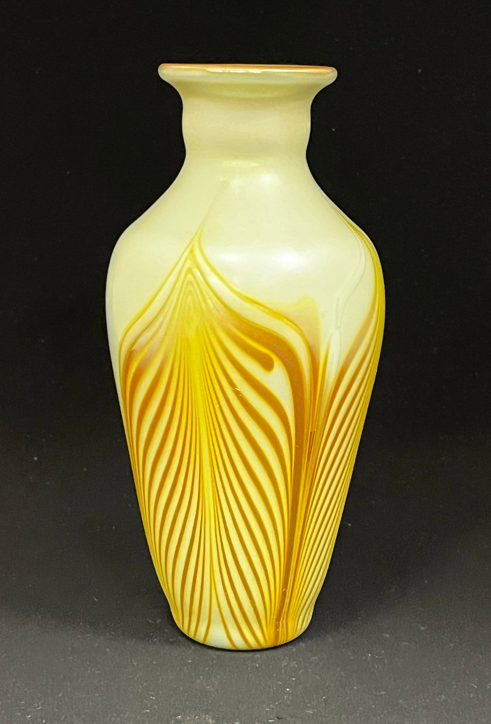 Donald Carlson gold pulled feather: Donald Carlson gold pulled feather glass vase set on an opal ground, signed Carlson 77, 7 1/2" ht. CONDITION: no chips, cracks, repairs or material defects found, Jaremos attempts to call any material