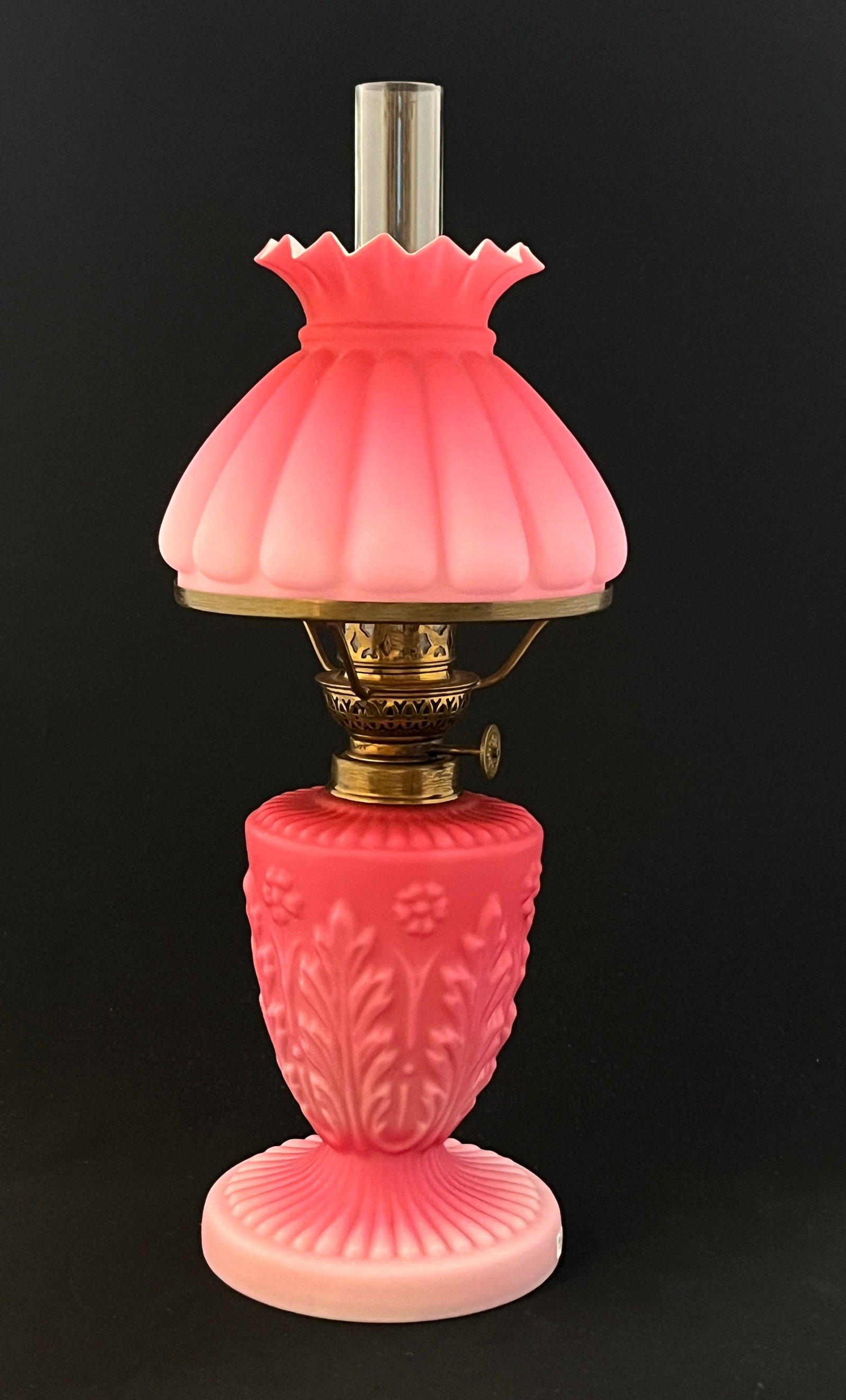 Pink satin glass lamp: Superb Pink satin glass lamp with molded acanthus leaf base; 12 1/2" ht with chimney. CONDITION: no chips, cracks, repairs or material defects found, Jaremos attempts to call any material flaw that af