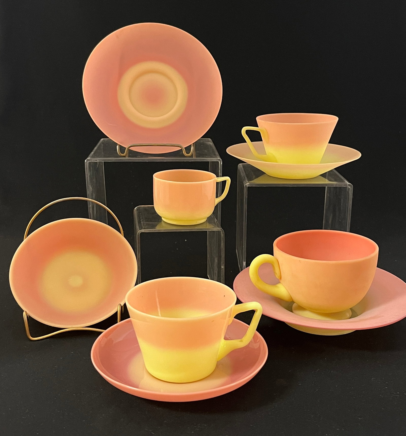 9 piece grouping of Uranium Burmese: 9 piece grouping of Uranium Burmese including cups and saucers mostly mis matched, widest 6" in diameter. CONDITION: one irregular foot