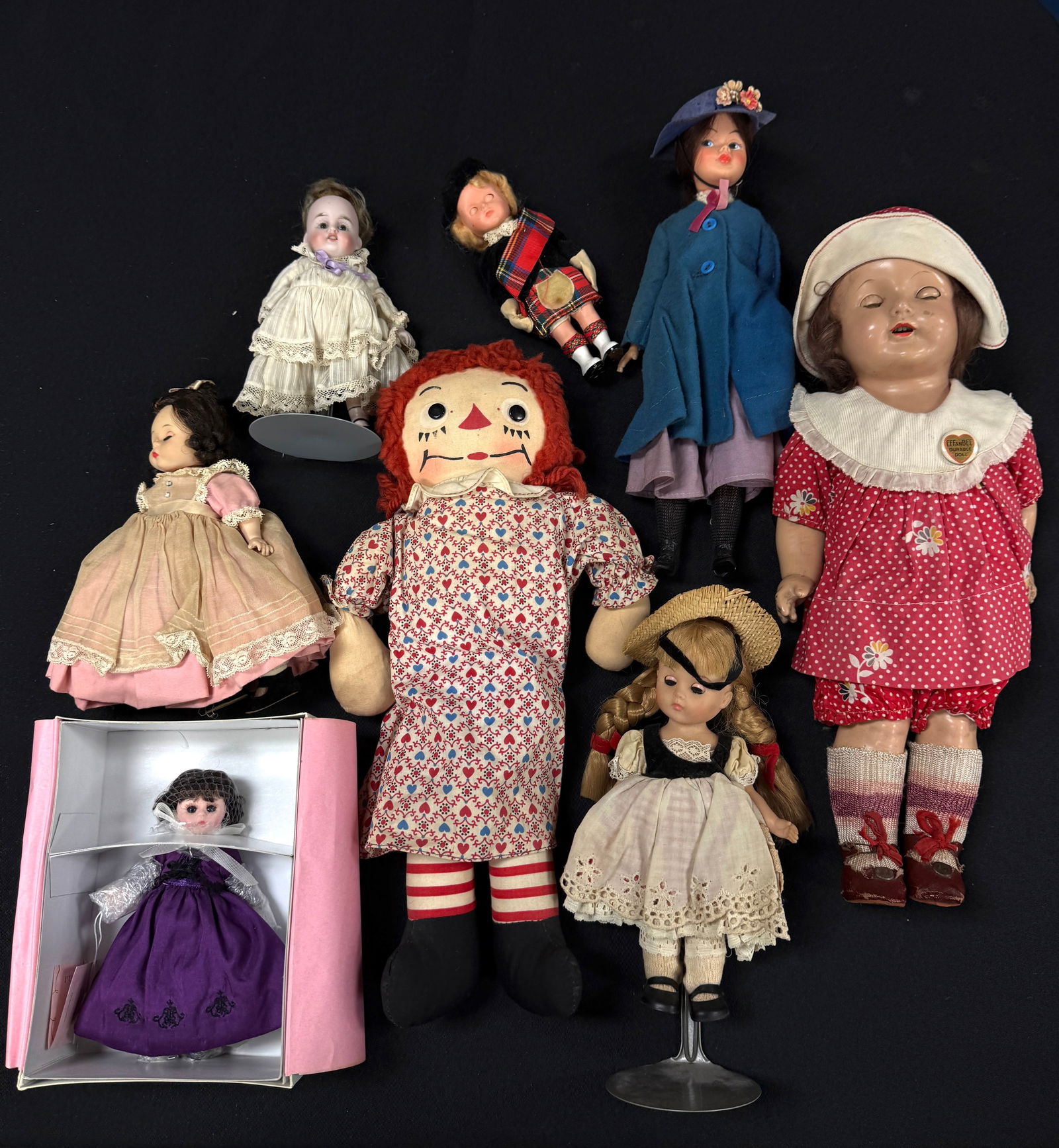 Group of Vintage Dolls: Group of 8 vintage dolls including a Madame Alexander "Meg", Raggedy Ann, Effanbee composition, Mary Poppins, and 2 bisque one with signature; 4 with movable eyes. CONDITION: wear commensurate with ag