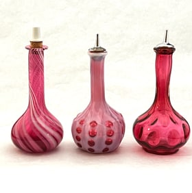 Three opalescent barber bottles