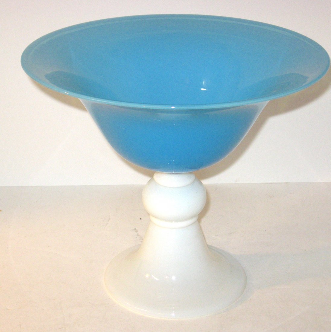 Large Steuben blue and opal compote,: flaring form light blue Jade compote with a baluster opal stem, 8 1/4" ht. by 10" wide.