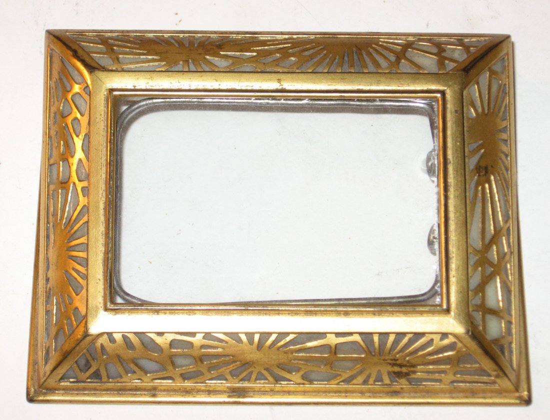 Louis C. Tiffany bronze and glass calendar,: Dore bronze calendar in the pine needle pattern with glass front, marked Tiffany Studios New York 930, 4 1/2" long