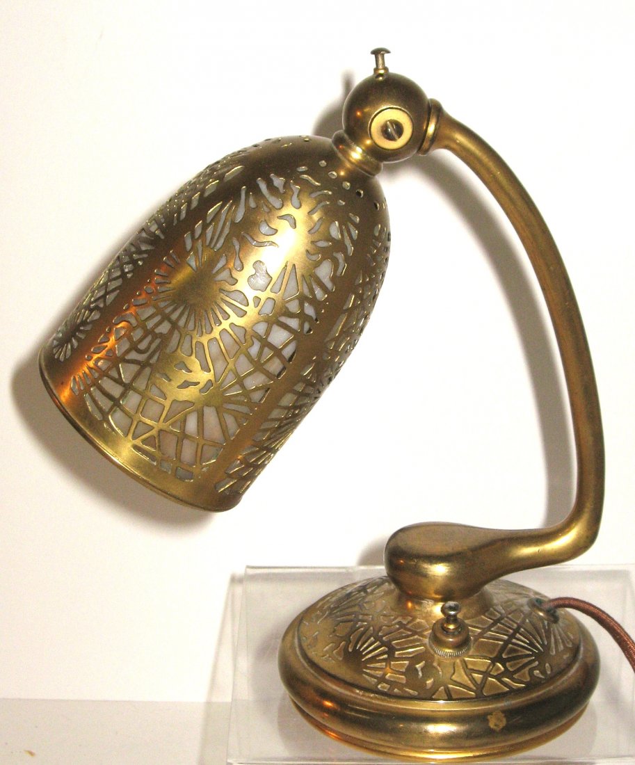 Louis C. Tiffany bronze and glass lamp,: Dore bronze C arm lamp in the pine needle pattern fitted with amber glass, marked Tiffany Studios New York 552, 8 1/2" ht.
