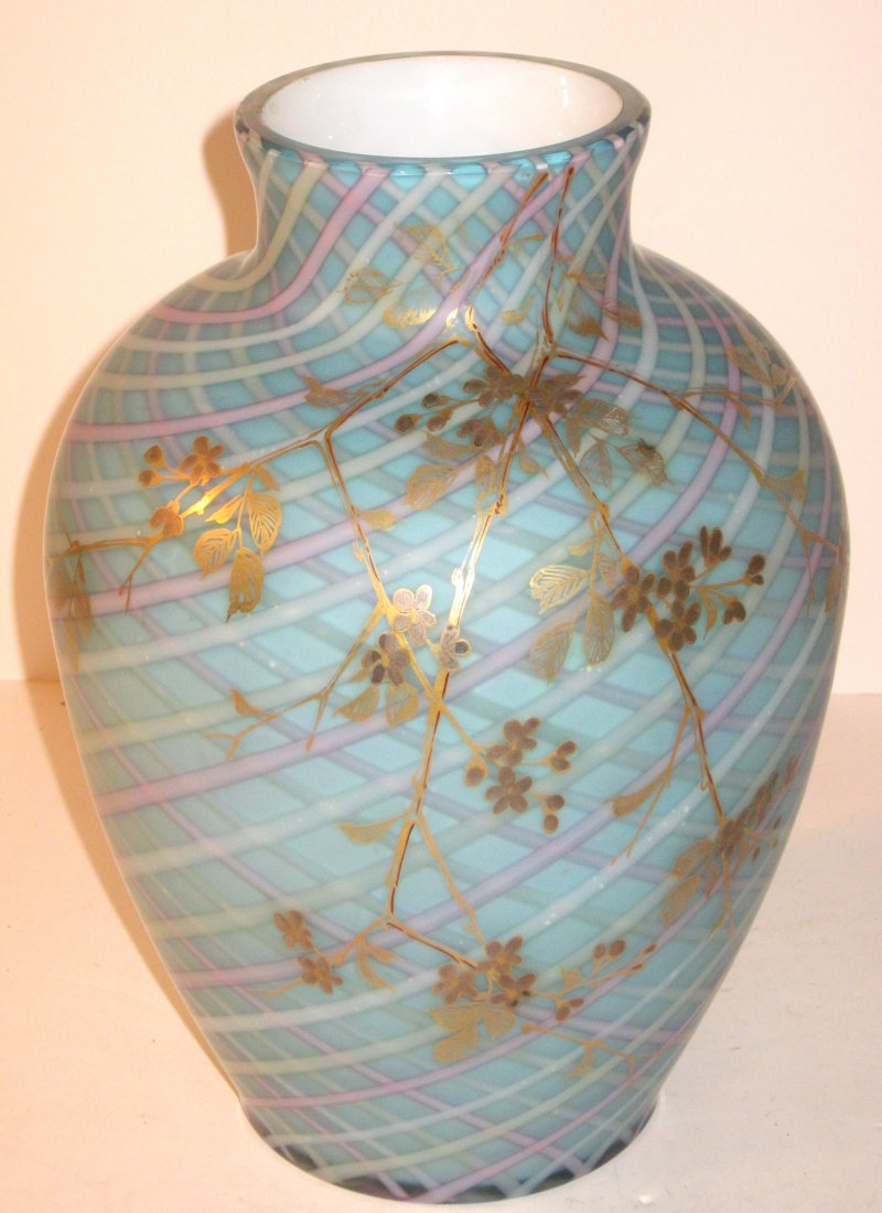 Harrach air trap MOP vase,: large shouldered form in robin egg blue decorated with air trapped ribbons of blue, yellow and pink and adorned with a cascading enameled gilt leafy branch, marked with the Harrach feather pinwheel, 1