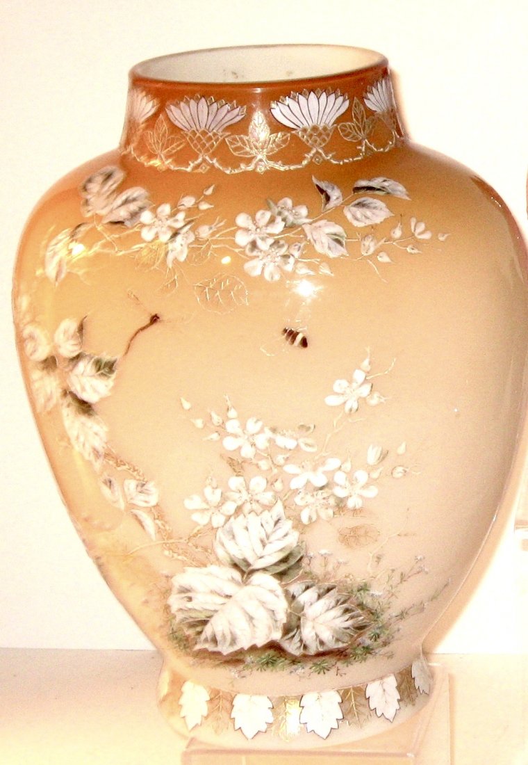 Webb cased Peach satin glass vase,: large urn form in opal to peach decorated with a heavy enameled leafy flower and flying bee, marked C43, 11" ht.