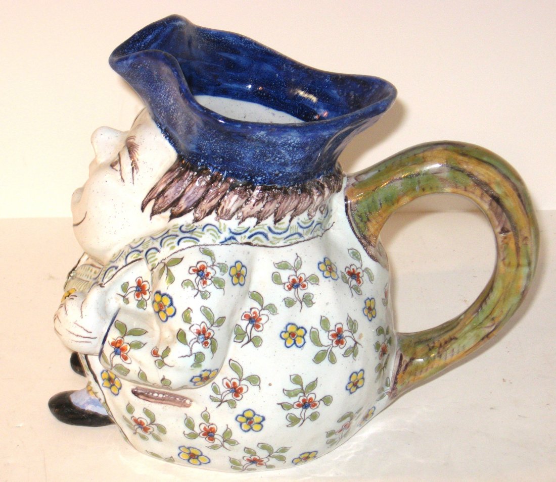 Desvres Fourmaintraux Toby Pitcher: having a floral jacket, vest and the brim of the hat forming the spout. Marked FC or FE 30 for Fourmaintraux Courquin or Emile Fourmaintraux. c.1900 7 1/2"H