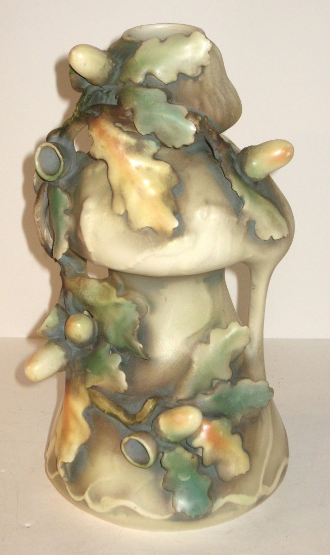 Amphora pottery vase,: cylindrical urn form decorated with raised acorns and leaves, marked with incised numbers 7524 37, 10 1/2" ht.