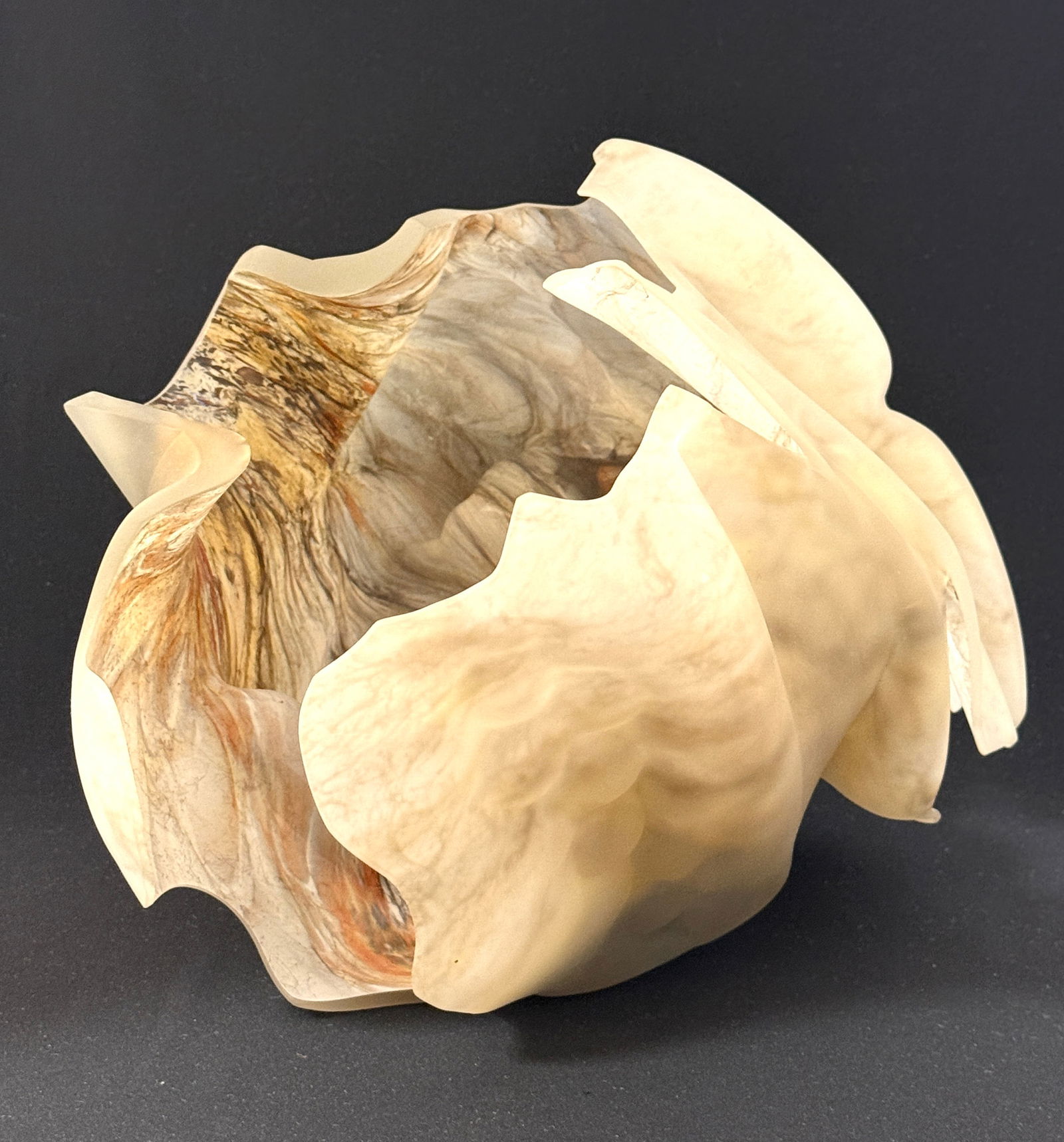 Marvin Lipofsky Shell Sculpture: Marvin Lipofsky shell sculpture, opal glass with earthtone colors of green, yellow, and tan, signed Lipofsky California Storm Series #40 1982; 11" ht 12" diameter. NOTE: Marvin Lipofsky is one of the