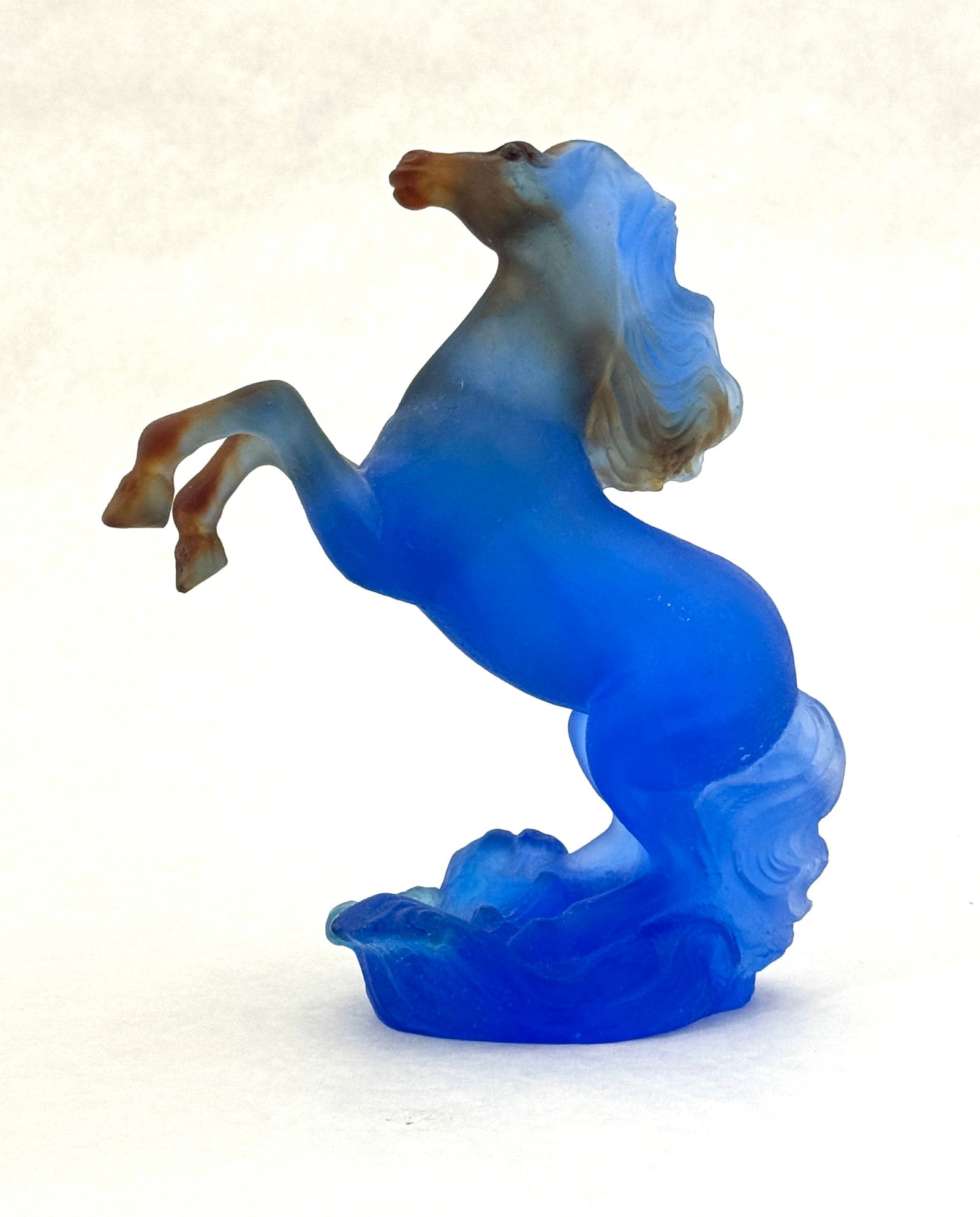 Daum Patte de Verre horse: Pate de Verre figural sculpture of a blue horse with amber highlights, signed Daum Nancy; 6 3/4" ht. CONDITION: no chips, cracks, repairs, or material defects found, Jaremos attempts to call any mater