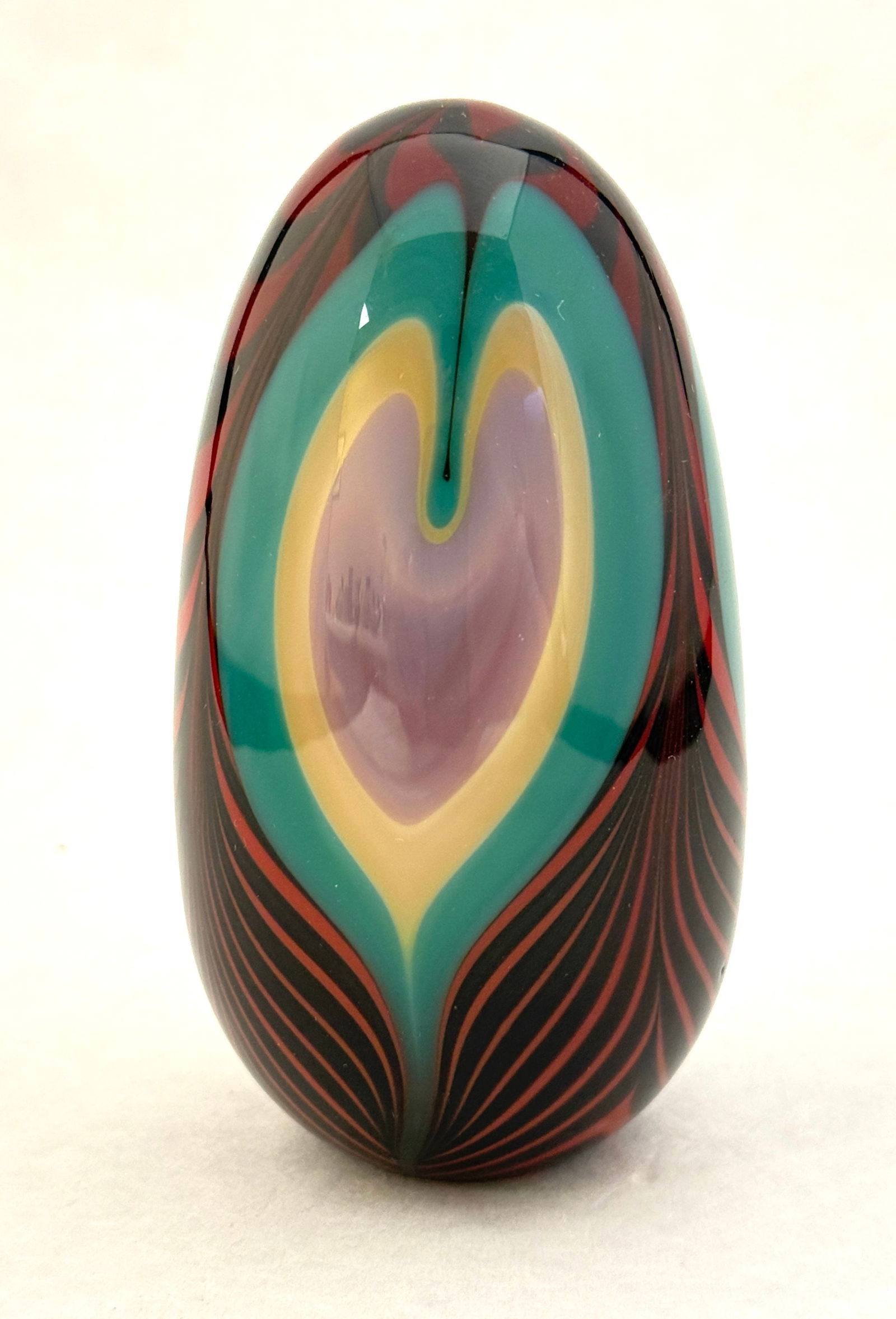 Levin Paperweight: Levin multicolored paperweight with pulled heart design, signed Levin 87; 4 3/8" ht. CONDITION: no chips, cracks, repairs, or material defects found, Jaremos attempts to call any material flaw that af