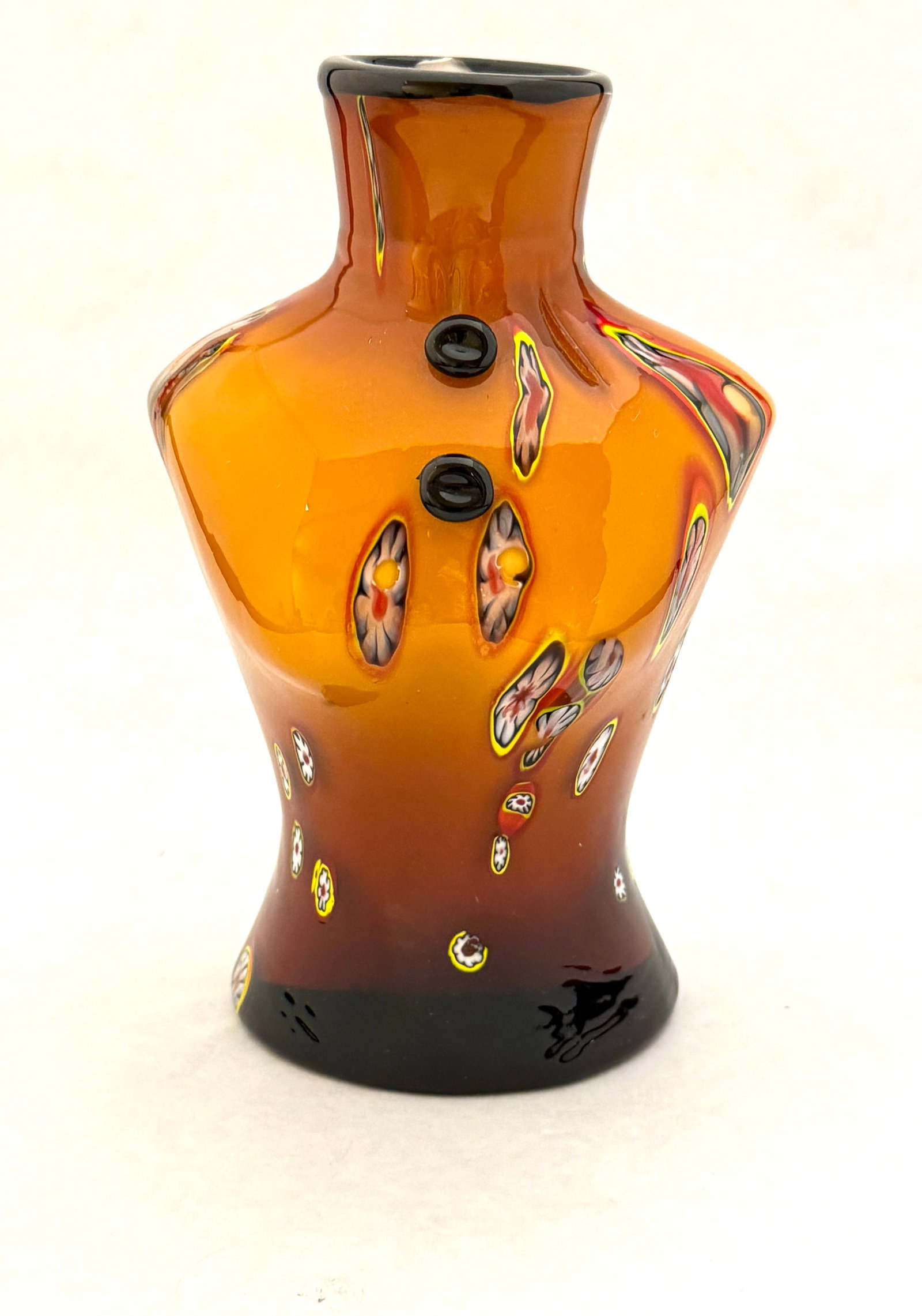 Murano Figural Bust Vase: Murano caramel bust figural vase with millefiori; 8" ht. CONDITION: no chips, cracks, repairs, or material defects found, Jaremos attempts to call any material flaw that affects the price, but minor s
