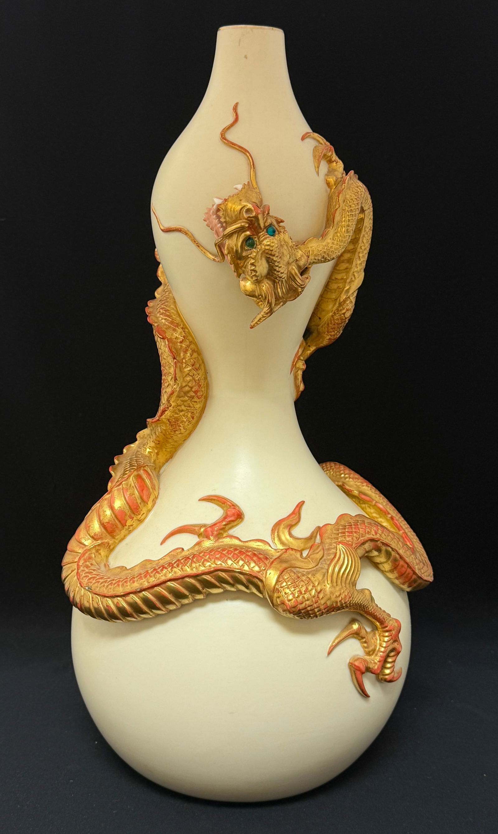 Royal Worchester Dragon Vase: Royal Worchester pottery dragon vase, tan with gold dragon with green jewel eyes wrapping around vase, marked and numbered; ht 18". CONDITION: no chips, cracks, repairs or material defects found. Jare