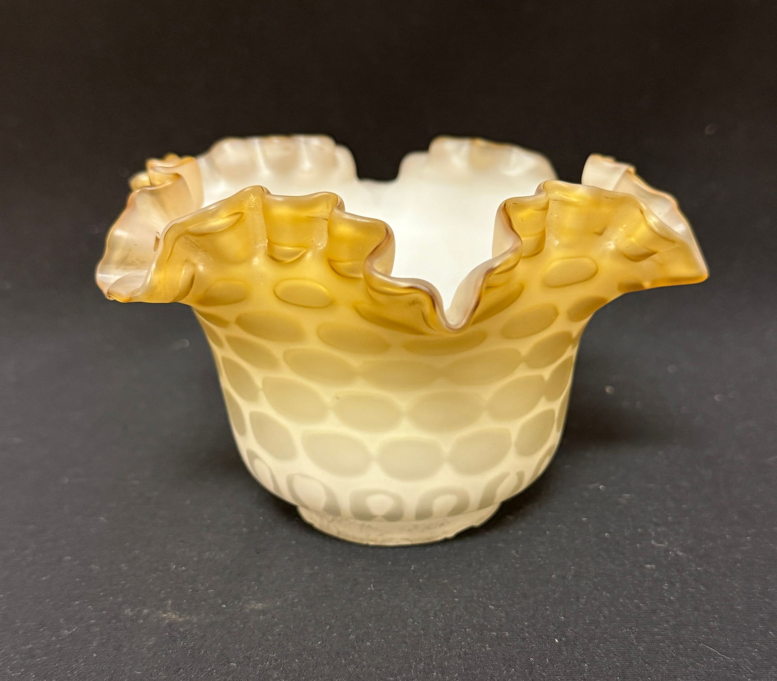 MOP Coin spot Glass Shade: Caramel Mother of Pearl ruffled rim shade in the coin spot pattern, 3 1/2" ht. fitter 2" wide. CONDITION: rough fitter rim